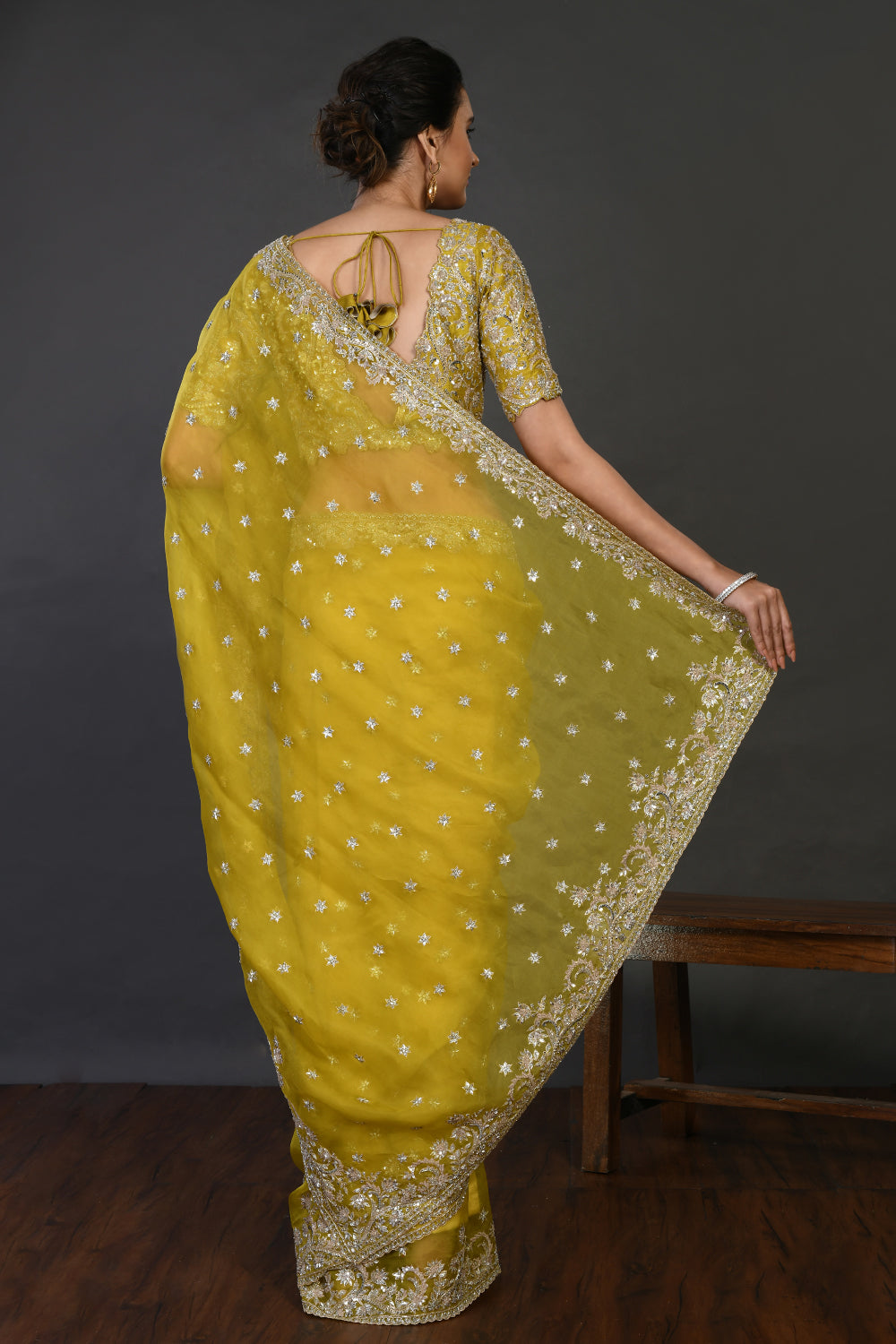 Buy mustard mirror and cutdana work organza sari online in USA with blouse. Make a fashion statement on festive occasions and weddings with designer sarees, designer suits, Indian dresses, Anarkali suits, palazzo suits, designer gowns, sharara suits, embroidered sarees from Pure Elegance Indian fashion store in USA.-back