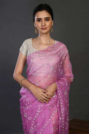 Buy onion pink embroidered organza sari online in USA with blouse. Make a fashion statement on festive occasions and weddings with designer sarees, designer suits, Indian dresses, Anarkali suits, palazzo suits, designer gowns, sharara suits, embroidered sarees from Pure Elegance Indian fashion store in USA.-closeup