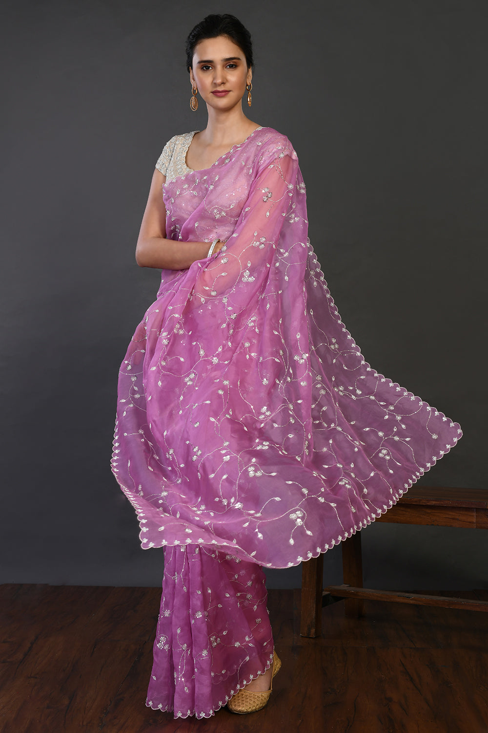 Buy onion pink embroidered organza sari online in USA with blouse. Make a fashion statement on festive occasions and weddings with designer sarees, designer suits, Indian dresses, Anarkali suits, palazzo suits, designer gowns, sharara suits, embroidered sarees from Pure Elegance Indian fashion store in USA.-front