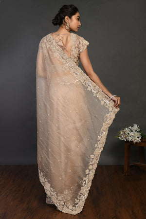 Shop beige embroidered organza sari online in USA with sequin border. Make a fashion statement on festive occasions and weddings with designer sarees, designer suits, Indian dresses, Anarkali suits, palazzo suits, designer gowns, sharara suits, embroidered sarees from Pure Elegance Indian fashion store in USA.-back
