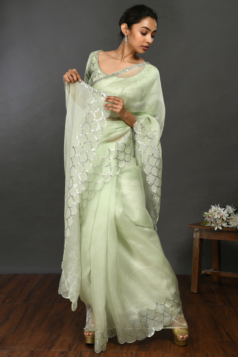Buy beautiful pista green stone and sequin work organza sari online in USA. Make a fashion statement on festive occasions and weddings with designer sarees, designer suits, Indian dresses, Anarkali suits, palazzo suits, designer gowns, sharara suits, embroidered sarees from Pure Elegance Indian fashion store in USA.-front