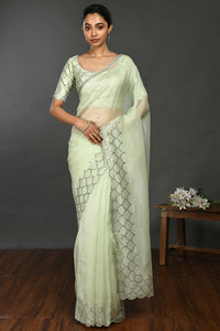 Buy beautiful pista green stone and sequin work organza sari online in USA. Make a fashion statement on festive occasions and weddings with designer sarees, designer suits, Indian dresses, Anarkali suits, palazzo suits, designer gowns, sharara suits, embroidered sarees from Pure Elegance Indian fashion store in USA.-full view