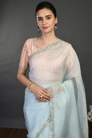 Shop doctor blue cutdana and sequin work organza sari online in USA. Make a fashion statement on festive occasions and weddings with designer sarees, designer suits, Indian dresses, Anarkali suits, palazzo suits, designer gowns, sharara suits, embroidered sarees from Pure Elegance Indian fashion store in USA.-closeup