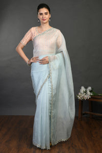 Shop doctor blue cutdana and sequin work organza sari online in USA. Make a fashion statement on festive occasions and weddings with designer sarees, designer suits, Indian dresses, Anarkali suits, palazzo suits, designer gowns, sharara suits, embroidered sarees from Pure Elegance Indian fashion store in USA.-full view