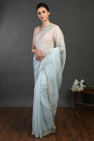Shop doctor blue cutdana and sequin work organza sari online in USA. Make a fashion statement on festive occasions and weddings with designer sarees, designer suits, Indian dresses, Anarkali suits, palazzo suits, designer gowns, sharara suits, embroidered sarees from Pure Elegance Indian fashion store in USA.-pallu