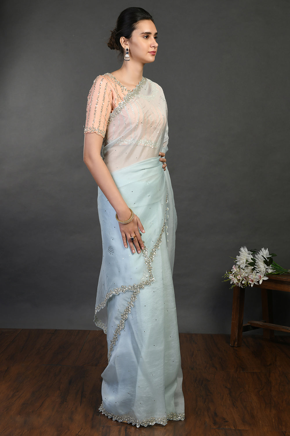 Shop doctor blue cutdana and sequin work organza sari online in USA. Make a fashion statement on festive occasions and weddings with designer sarees, designer suits, Indian dresses, Anarkali suits, palazzo suits, designer gowns, sharara suits, embroidered sarees from Pure Elegance Indian fashion store in USA.-right