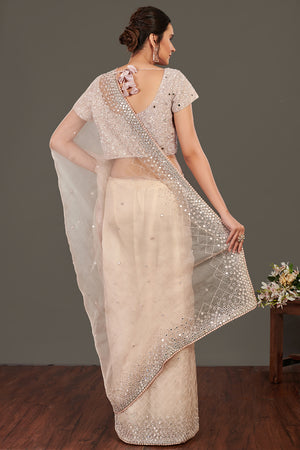 Shop beige mirror work organza sari online in USA with blouse. Make a fashion statement on festive occasions and weddings with designer sarees, designer suits, Indian dresses, Anarkali suits, palazzo suits, designer gowns, sharara suits, embroidered sarees from Pure Elegance Indian fashion store in USA.-back