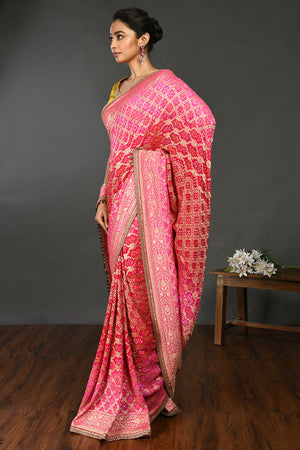 Buy fuschia pink gota and stone work bandhej sari online in USA with blouse. Make a fashion statement on festive occasions and weddings with designer sarees, designer suits, Indian dresses, Anarkali suits, palazzo suits, designer gowns, sharara suits, embroidered sarees from Pure Elegance Indian fashion store in USA.-pallu