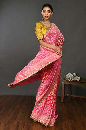Buy fuschia pink gota and stone work bandhej sari online in USA with blouse. Make a fashion statement on festive occasions and weddings with designer sarees, designer suits, Indian dresses, Anarkali suits, palazzo suits, designer gowns, sharara suits, embroidered sarees from Pure Elegance Indian fashion store in USA.-right