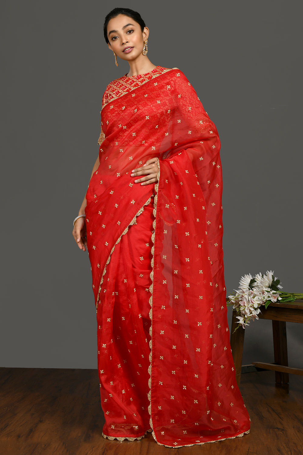 Shop red sequin and zari organza sari online in USA with blouse. Make a fashion statement on festive occasions and weddings with designer sarees, designer suits, Indian dresses, Anarkali suits, palazzo suits, designer gowns, sharara suits, embroidered sarees from Pure Elegance Indian fashion store in USA.-pallu