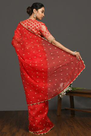 Shop red sequin and zari organza sari online in USA with blouse. Make a fashion statement on festive occasions and weddings with designer sarees, designer suits, Indian dresses, Anarkali suits, palazzo suits, designer gowns, sharara suits, embroidered sarees from Pure Elegance Indian fashion store in USA.-back
