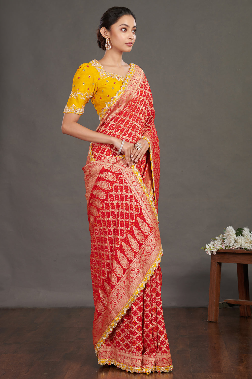 Buy red embroidered bandhej sari online in USA with yellow blouse. Make a fashion statement on festive occasions and weddings with designer sarees, designer suits, Indian dresses, Anarkali suits, palazzo suits, designer gowns, sharara suits, embroidered sarees from Pure Elegance Indian fashion store in USA.-side
