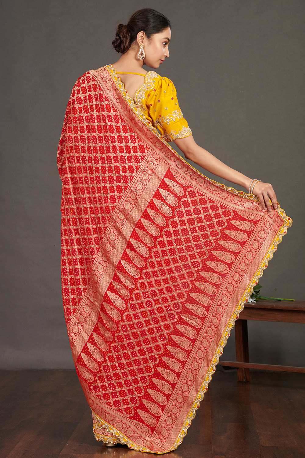 Buy red embroidered bandhej sari online in USA with yellow blouse. Make a fashion statement on festive occasions and weddings with designer sarees, designer suits, Indian dresses, Anarkali suits, palazzo suits, designer gowns, sharara suits, embroidered sarees from Pure Elegance Indian fashion store in USA.-back