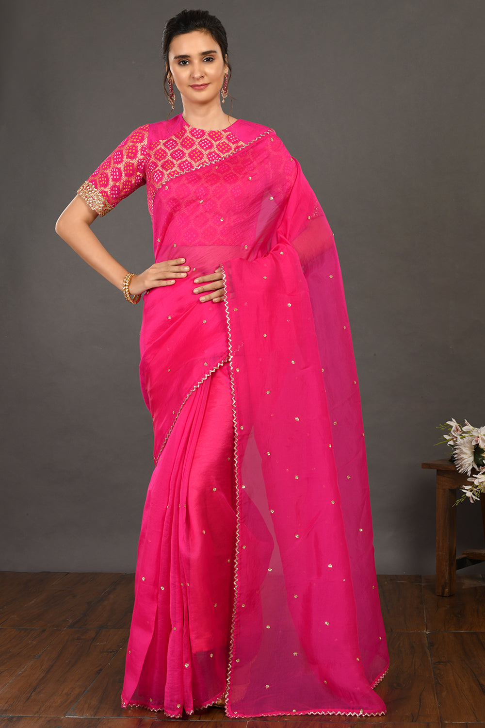 Shop pink embroidered organza sari online in USA with bandhej blouse. Make a fashion statement on festive occasions and weddings with designer sarees, designer suits, Indian dresses, Anarkali suits, palazzo suits, designer gowns, sharara suits, embroidered sarees from Pure Elegance Indian fashion store in USA.-full view