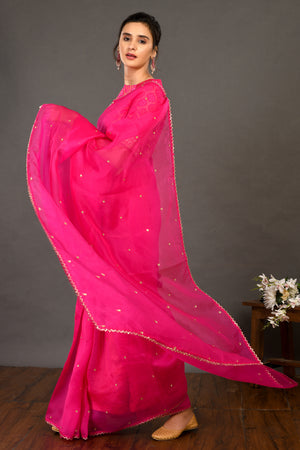 Shop pink embroidered organza sari online in USA with bandhej blouse. Make a fashion statement on festive occasions and weddings with designer sarees, designer suits, Indian dresses, Anarkali suits, palazzo suits, designer gowns, sharara suits, embroidered sarees from Pure Elegance Indian fashion store in USA.-pallu