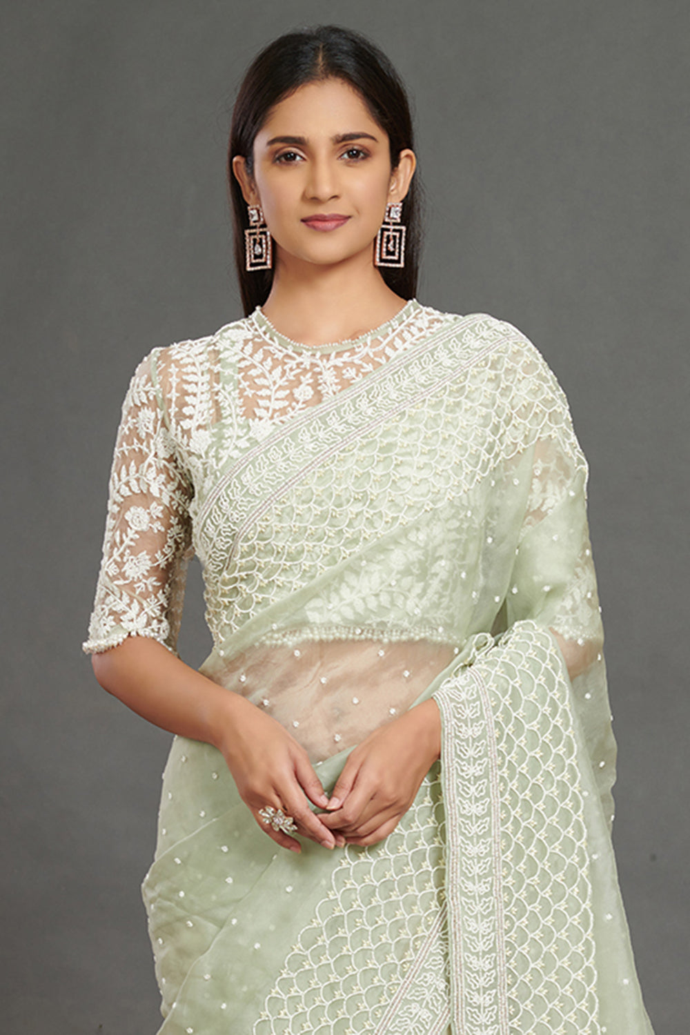 Shop mint green embroidered organza sari online in USA with blouse. Make a fashion statement on festive occasions and weddings with designer sarees, designer suits, Indian dresses, Anarkali suits, palazzo suits, designer gowns, sharara suits, embroidered sarees from Pure Elegance Indian fashion store in USA.-closeup