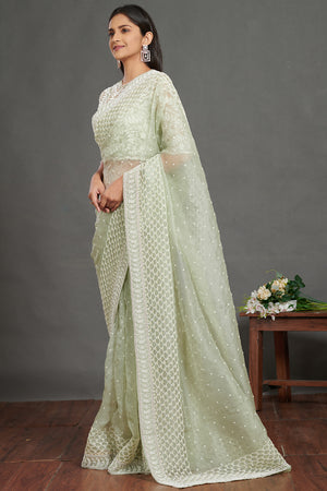 Shop mint green embroidered organza sari online in USA with blouse. Make a fashion statement on festive occasions and weddings with designer sarees, designer suits, Indian dresses, Anarkali suits, palazzo suits, designer gowns, sharara suits, embroidered sarees from Pure Elegance Indian fashion store in USA.-pallu