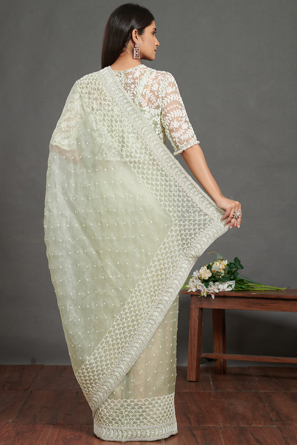 Shop mint green embroidered organza sari online in USA with blouse. Make a fashion statement on festive occasions and weddings with designer sarees, designer suits, Indian dresses, Anarkali suits, palazzo suits, designer gowns, sharara suits, embroidered sarees from Pure Elegance Indian fashion store in USA.-back