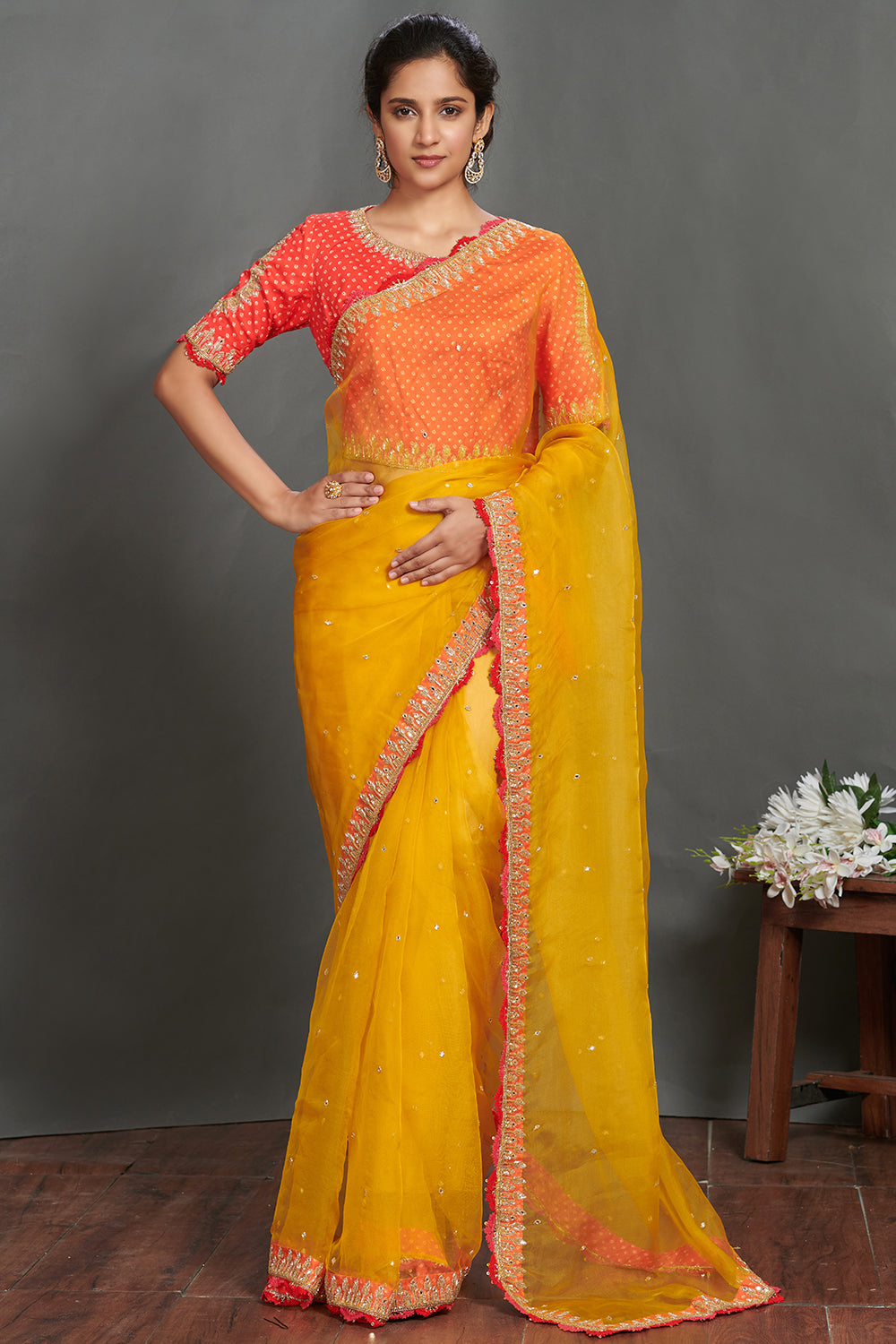 Shop mustard embroidered organza sari online in USA with orange blouse. Make a fashion statement on festive occasions and weddings with designer sarees, designer suits, Indian dresses, Anarkali suits, palazzo suits, designer gowns, sharara suits, embroidered sarees from Pure Elegance Indian fashion store in USA.-full view