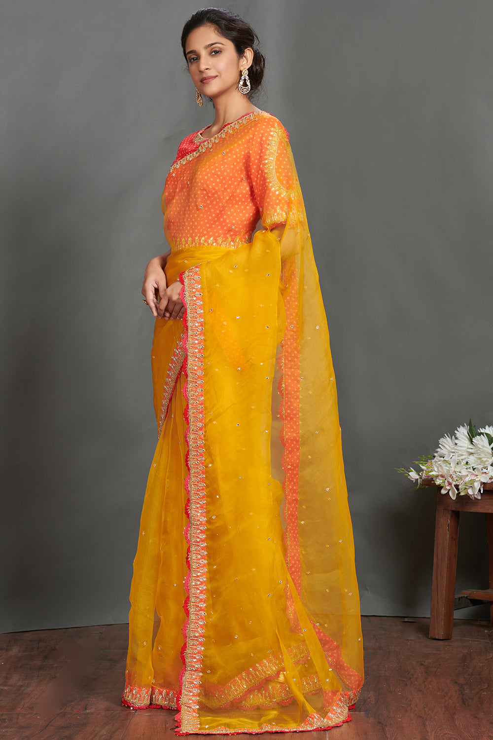 Shop mustard embroidered organza sari online in USA with orange blouse. Make a fashion statement on festive occasions and weddings with designer sarees, designer suits, Indian dresses, Anarkali suits, palazzo suits, designer gowns, sharara suits, embroidered sarees from Pure Elegance Indian fashion store in USA.-pallu