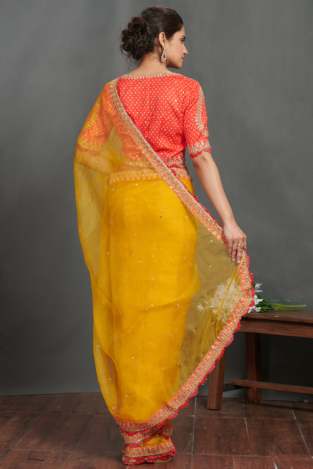 Shop mustard embroidered organza sari online in USA with orange blouse. Make a fashion statement on festive occasions and weddings with designer sarees, designer suits, Indian dresses, Anarkali suits, palazzo suits, designer gowns, sharara suits, embroidered sarees from Pure Elegance Indian fashion store in USA.-back