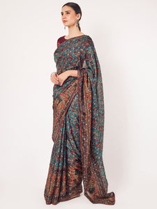 Buy stunning green printed muslin sari online in USA with blouse. Make a fashion statement on festive occasions and weddings with designer sarees, designer suits, Indian dresses, Anarkali suits, palazzo suits, designer gowns, sharara suits, embroidered sarees from Pure Elegance Indian fashion store in USA.-full view