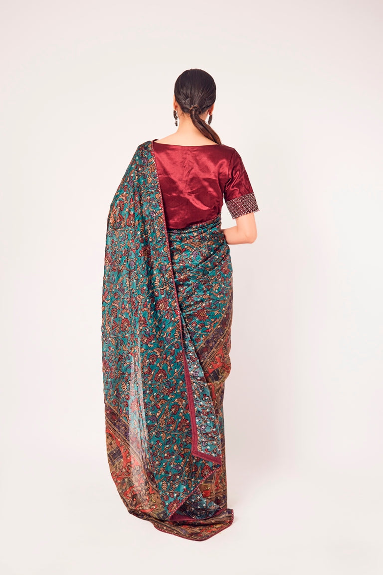 Buy stunning green printed muslin sari online in USA with blouse. Make a fashion statement on festive occasions and weddings with designer sarees, designer suits, Indian dresses, Anarkali suits, palazzo suits, designer gowns, sharara suits, embroidered sarees from Pure Elegance Indian fashion store in USA.-back