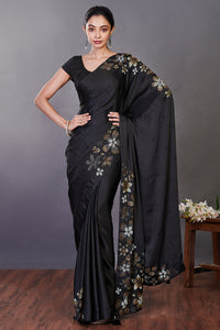 Shop black Swarovski floral motifs satin sari online in USA with blouse. Make a fashion statement on festive occasions and weddings with designer sarees, designer suits, Indian dresses, Anarkali suits, palazzo suits, designer gowns, sharara suits, embroidered sarees from Pure Elegance Indian fashion store in USA.-full view