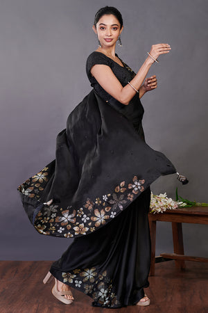 Shop black Swarovski floral motifs satin sari online in USA with blouse. Make a fashion statement on festive occasions and weddings with designer sarees, designer suits, Indian dresses, Anarkali suits, palazzo suits, designer gowns, sharara suits, embroidered sarees from Pure Elegance Indian fashion store in USA.-side