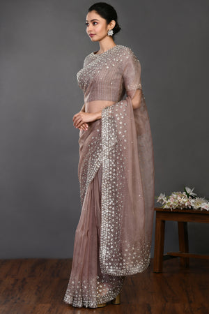 Shop beige embroidered designer organza sari online in USA with blouse. Make a fashion statement on festive occasions and weddings with designer sarees, designer suits, Indian dresses, Anarkali suits, palazzo suits, designer gowns, sharara suits, embroidered sarees from Pure Elegance Indian fashion store in USA.-pallu