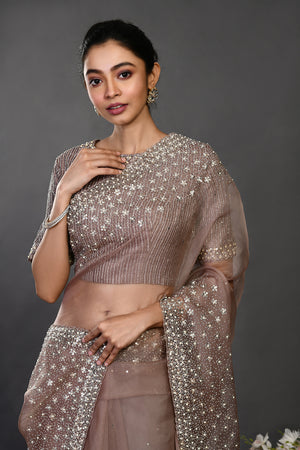 Shop beige embroidered designer organza sari online in USA with blouse. Make a fashion statement on festive occasions and weddings with designer sarees, designer suits, Indian dresses, Anarkali suits, palazzo suits, designer gowns, sharara suits, embroidered sarees from Pure Elegance Indian fashion store in USA.-closeup