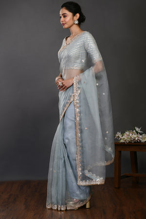 Buy doctor blue mirror and zari work organza sari online in USA with blouse. Make a fashion statement on festive occasions and weddings with designer sarees, designer suits, Indian dresses, Anarkali suits, palazzo suits, designer gowns, sharara suits, embroidered sarees from Pure Elegance Indian fashion store in USA.-pallu