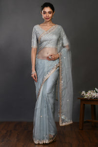 Buy doctor blue mirror and zari work organza sari online in USA with blouse. Make a fashion statement on festive occasions and weddings with designer sarees, designer suits, Indian dresses, Anarkali suits, palazzo suits, designer gowns, sharara suits, embroidered sarees from Pure Elegance Indian fashion store in USA.-full view