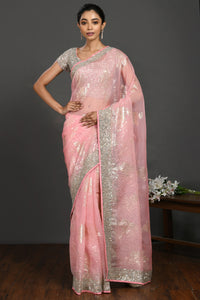 Buy light pink cutdana and stone work organza sari online in USA with blouse. Make a fashion statement on festive occasions and weddings with designer sarees, designer suits, Indian dresses, Anarkali suits, palazzo suits, designer gowns, sharara suits, embroidered sarees from Pure Elegance Indian fashion store in USA.-full view