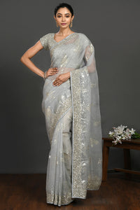 Shop doctor blue cutdana and stone work organza sari online in USA with blouse. Make a fashion statement on festive occasions and weddings with designer sarees, designer suits, Indian dresses, Anarkali suits, palazzo suits, designer gowns, sharara suits, embroidered sarees from Pure Elegance Indian fashion store in USA.-full view