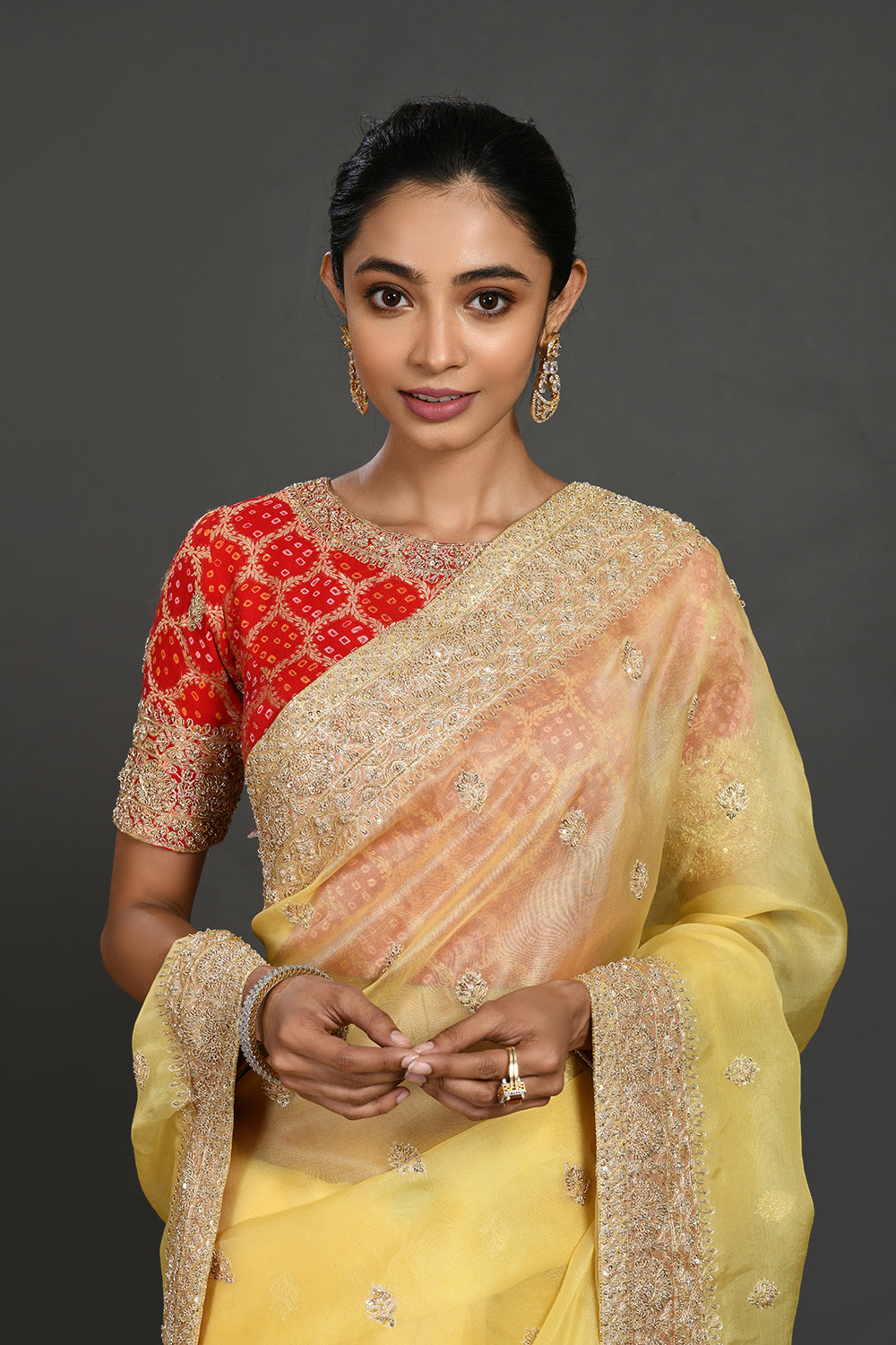 Buy yellow embroidered organza sari online in USA with red blouse. Make a fashion statement on festive occasions and weddings with designer sarees, designer suits, Indian dresses, Anarkali suits, palazzo suits, designer gowns, sharara suits, embroidered sarees from Pure Elegance Indian fashion store in USA.-closeup