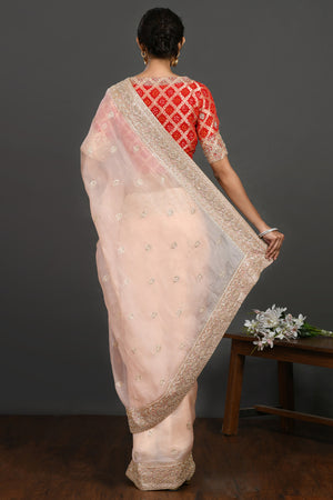 Buy powder pink embroidered organza sari online in USA with red blouse. Make a fashion statement on festive occasions and weddings with designer sarees, designer suits, Indian dresses, Anarkali suits, palazzo suits, designer gowns, sharara suits, embroidered sarees from Pure Elegance Indian fashion store in USA.-back