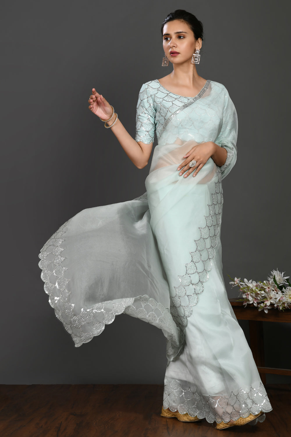 Shop aqua blue stone and sequin work organza sari online in USA. Make a fashion statement on festive occasions and weddings with designer sarees, designer suits, Indian dresses, Anarkali suits, palazzo suits, designer gowns, sharara suits, embroidered sarees from Pure Elegance Indian fashion store in USA.-full view