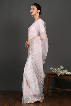 Buy powder pink stone and sequin work organza sari online in USA. Make a fashion statement on festive occasions and weddings with designer sarees, designer suits, Indian dresses, Anarkali suits, palazzo suits, designer gowns, sharara suits, embroidered sarees from Pure Elegance Indian fashion store in USA.-pallu
