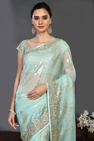 Buy mint green cutdana and stonework organza saree online in USA. Make a fashion statement on festive occasions and weddings with designer sarees, designer suits, Indian dresses, Anarkali suits, palazzo suits, designer gowns, sharara suits, embroidered sarees from Pure Elegance Indian fashion store in USA.-closeup