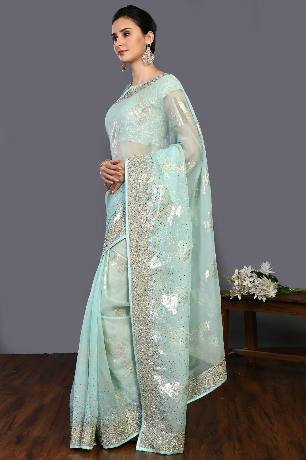 Buy mint green cutdana and stonework organza saree online in USA. Make a fashion statement on festive occasions and weddings with designer sarees, designer suits, Indian dresses, Anarkali suits, palazzo suits, designer gowns, sharara suits, embroidered sarees from Pure Elegance Indian fashion store in USA.-pallu