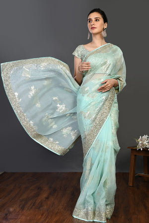 Buy mint green cutdana and stonework organza saree online in USA. Make a fashion statement on festive occasions and weddings with designer sarees, designer suits, Indian dresses, Anarkali suits, palazzo suits, designer gowns, sharara suits, embroidered sarees from Pure Elegance Indian fashion store in USA.-front