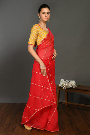 Buy red gota work saree online in USA with embroidered yellow blouse. Make a fashion statement on festive occasions and weddings with designer sarees, designer suits, Indian dresses, Anarkali suits, palazzo suits, designer gowns, sharara suits, embroidered sarees from Pure Elegance Indian fashion store in USA.-right