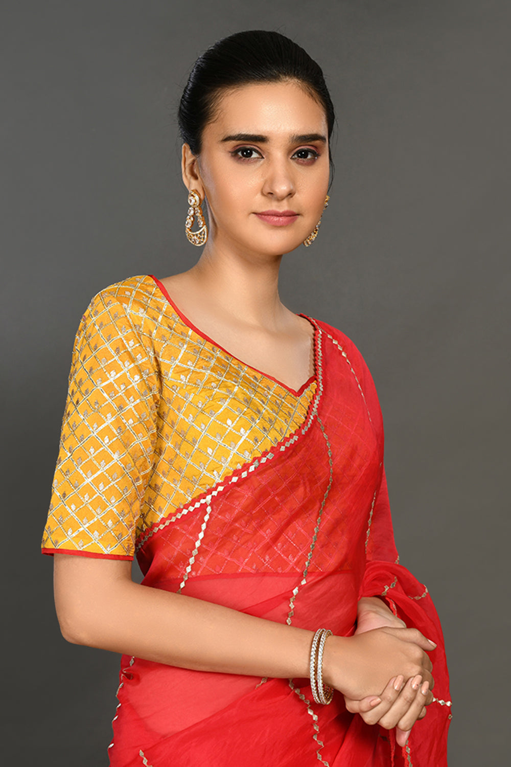 Buy red gota work saree online in USA with embroidered yellow blouse. Make a fashion statement on festive occasions and weddings with designer sarees, designer suits, Indian dresses, Anarkali suits, palazzo suits, designer gowns, sharara suits, embroidered sarees from Pure Elegance Indian fashion store in USA.-closeup