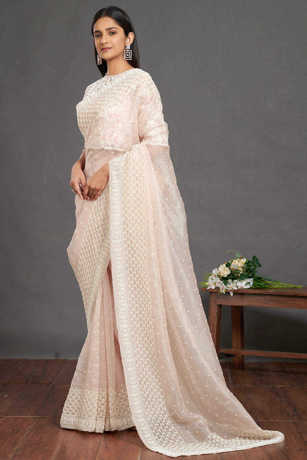 Shop powder pink embroidered organza saree online in USA with lace border. Make a fashion statement on festive occasions and weddings with designer sarees, designer suits, Indian dresses, Anarkali suits, palazzo suits, designer gowns, sharara suits, embroidered sarees from Pure Elegance Indian fashion store in USA.-pallu