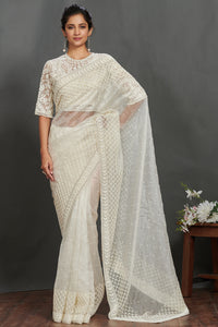 Buy off-white embroidered organza saree online in USA with lace border. Make a fashion statement on festive occasions and weddings with designer sarees, designer suits, Indian dresses, Anarkali suits, palazzo suits, designer gowns, sharara suits, embroidered sarees from Pure Elegance Indian fashion store in USA.-full view