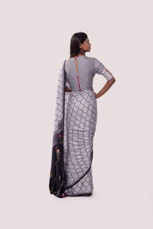 Shop white and black printed handloom saree online in USA with blouse. Make a fashion statement on festive occasions and weddings with designer sarees, designer suits, Indian dresses, Anarkali suits, palazzo suits, designer gowns, sharara suits, embroidered sarees from Pure Elegance Indian fashion store in USA.-back