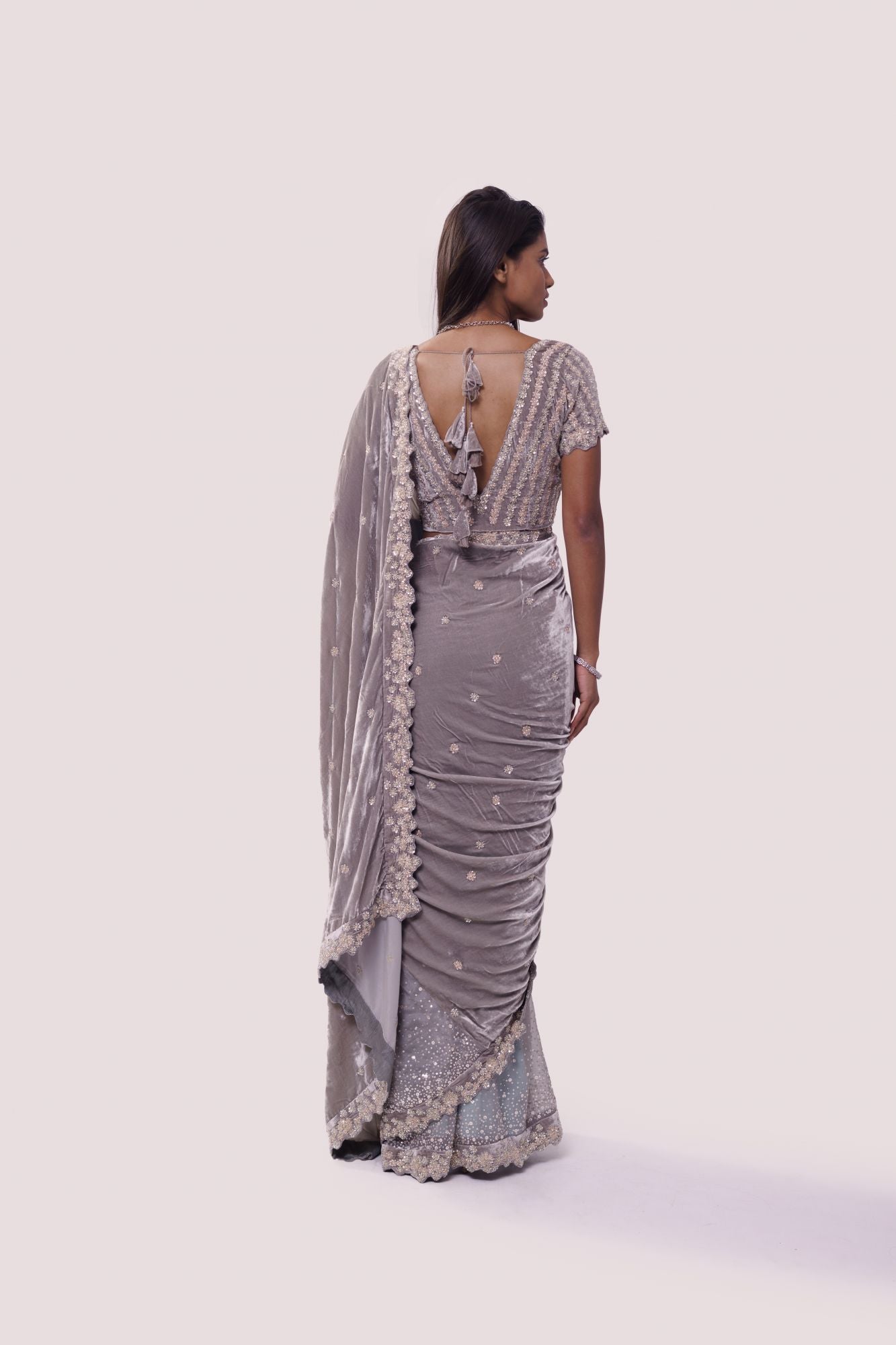 Shop grey embroidered organza and velvet saree online in USA with blouse. Make a fashion statement on festive occasions and weddings with designer sarees, designer suits, Indian dresses, Anarkali suits, palazzo suits, designer gowns, sharara suits, embroidered sarees from Pure Elegance Indian fashion store in USA.-back