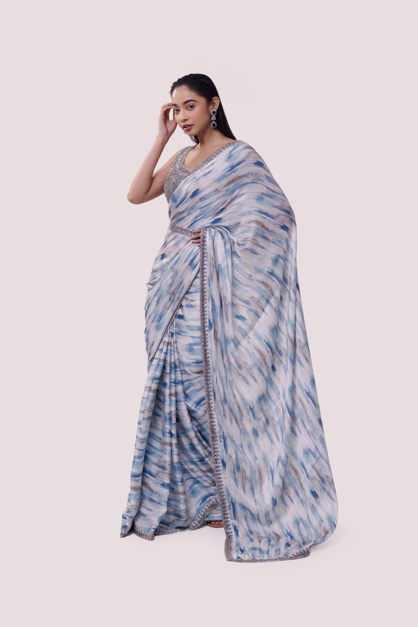 Buy white and blue embroidered satin saree online in USA with blouse. Make a fashion statement on festive occasions and weddings with designer sarees, designer suits, Indian dresses, Anarkali suits, palazzo suits, designer gowns, sharara suits, embroidered sarees from Pure Elegance Indian fashion store in USA.-pallu