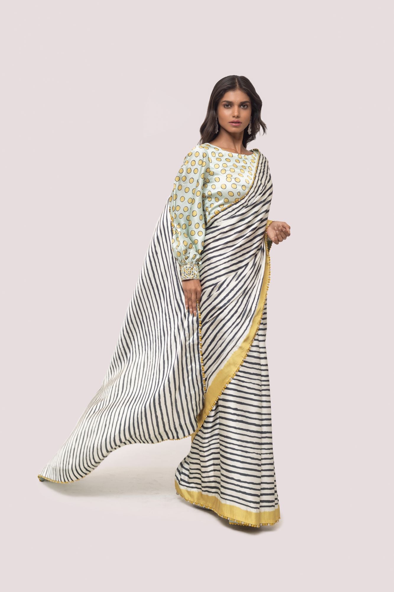 Shop white and black stripes satin saree online in USA with mint green blouse. Make a fashion statement on festive occasions and weddings with designer sarees, designer suits, Indian dresses, Anarkali suits, palazzo suits, designer gowns, sharara suits, embroidered sarees from Pure Elegance Indian fashion store in USA.-front